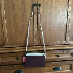 Kate spade crossbody.  Two compartments, adjustable strap.  Burgundy/tan.